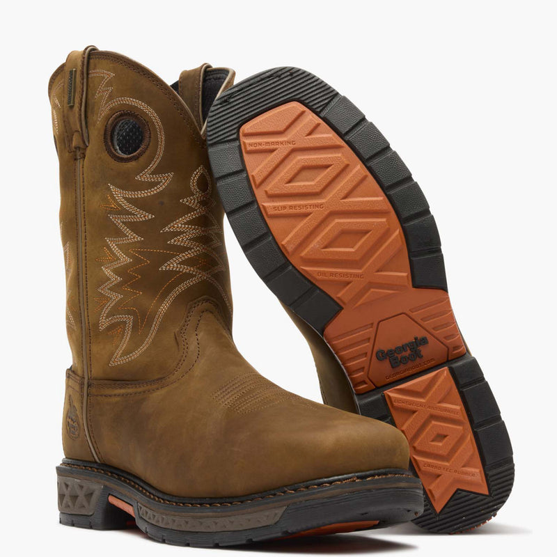 Brown work boot with orange and black sole on a white background