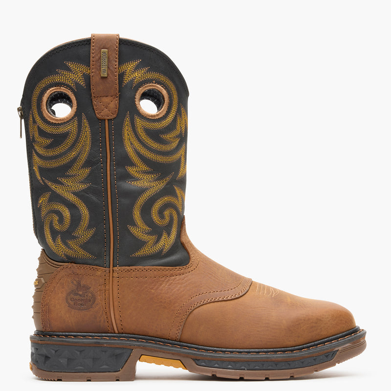 Brown cowboy boot with black leather upper on a white background